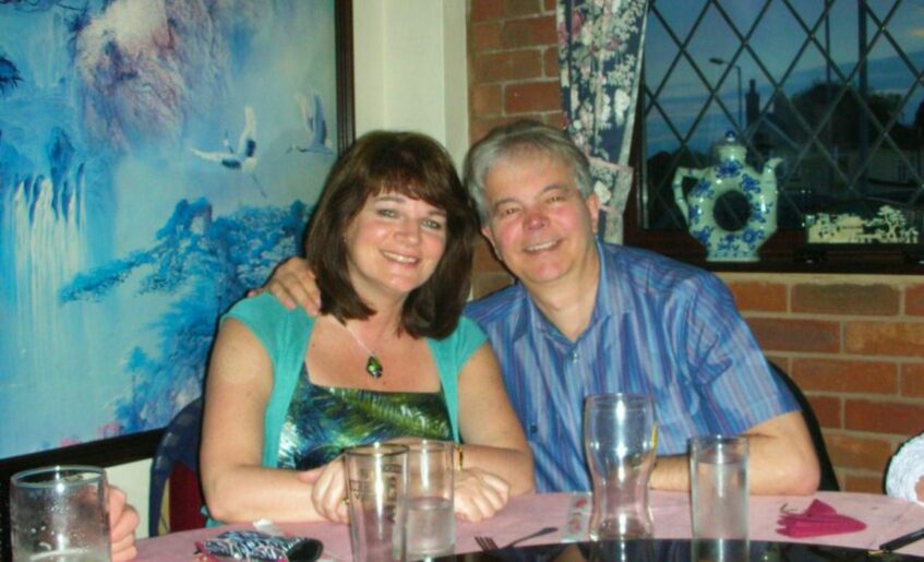 Andy and Helen sitting together at a restaurant