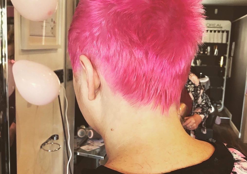 Jennie Oaks with pink hair after her head shave