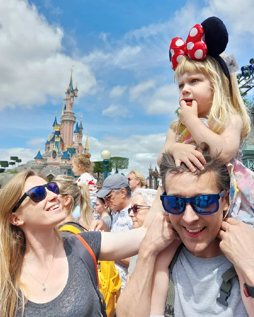 Dan and his family together at Disneyland